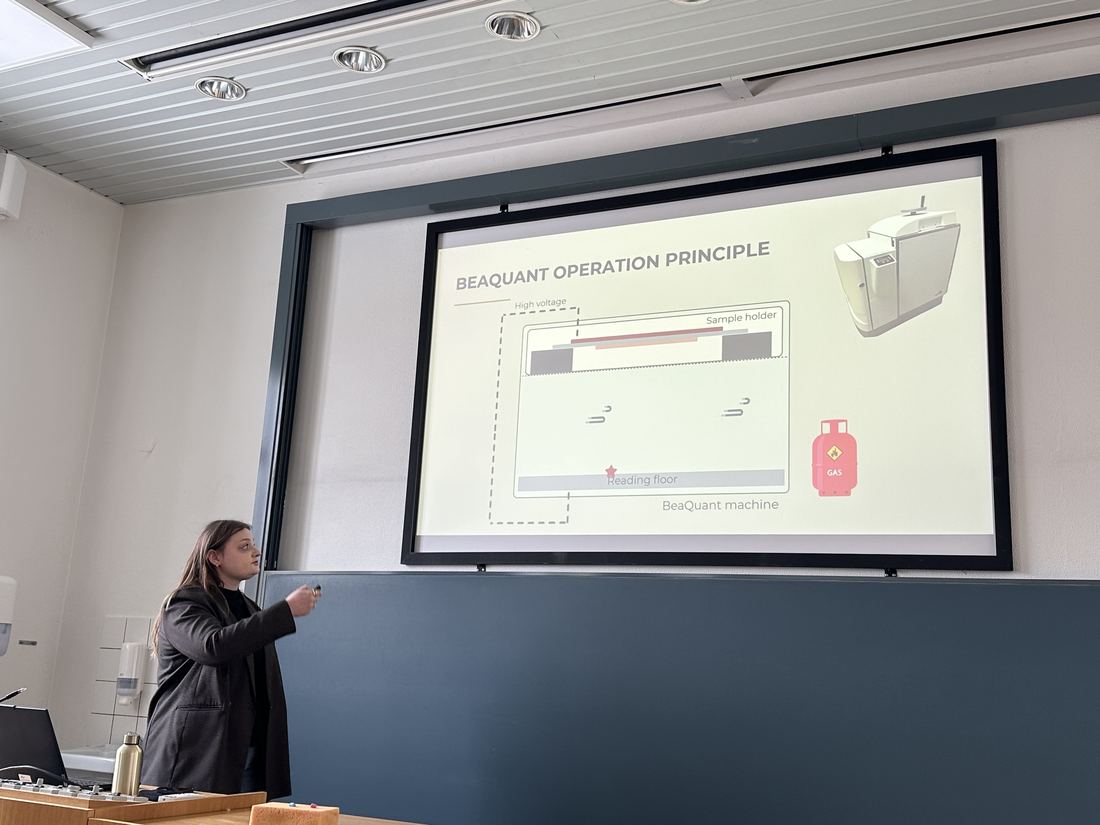 Celine Knudsen presenting, with a slide explaining how the BeaQuant real-time autoradiography instrument works.